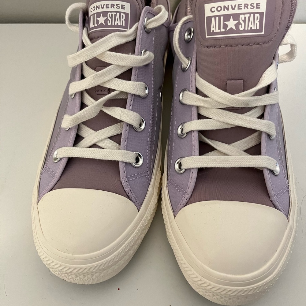 Lavender or light yellow converse shoes. Mesh material